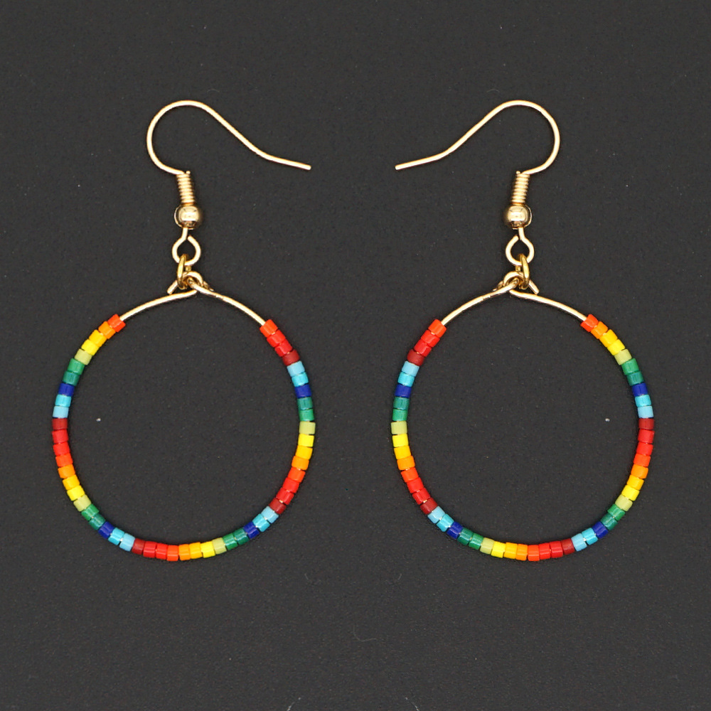 Fashion Exaggerated Rice Bead Woven Large Hoop Earrings display picture 1