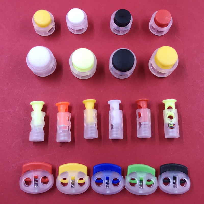 Manufacturer supplies plastic spring buckle cylindrical double hole buckle bell cap rope buckle black and white transparent