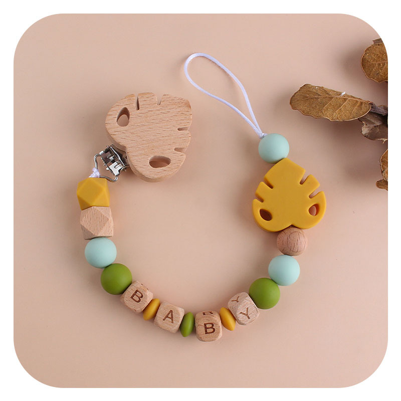 Nombre del bebé personalizable Cadena de chupete de hoja de silicona Bebé suministros de haya hoja chupete clip juguete mordedor