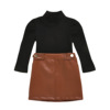 Two piece girl’s dress with high collar and long sleeve top and button open bag leather skirt