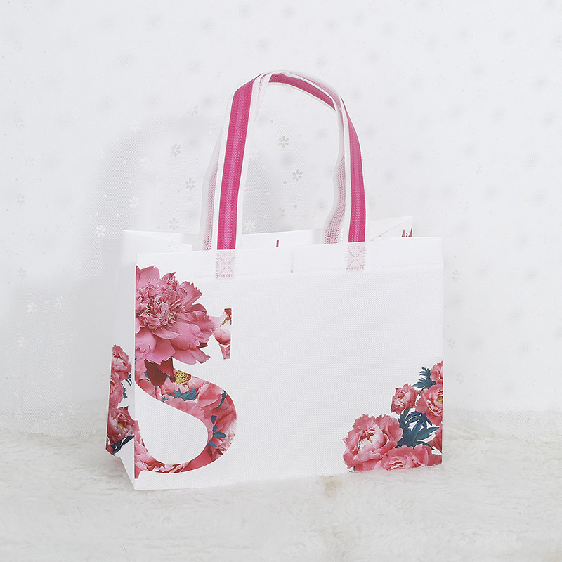 En stock bolsa de tienda de ropa logotipo personalizado bolsa de protección ambiental personalizada bolsa de embalaje de cuatro piezas bolso no tejido recubierto