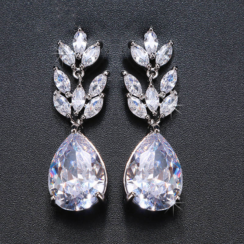 Fashionable elegant shiny earrings for bride drop-shaped with zircon