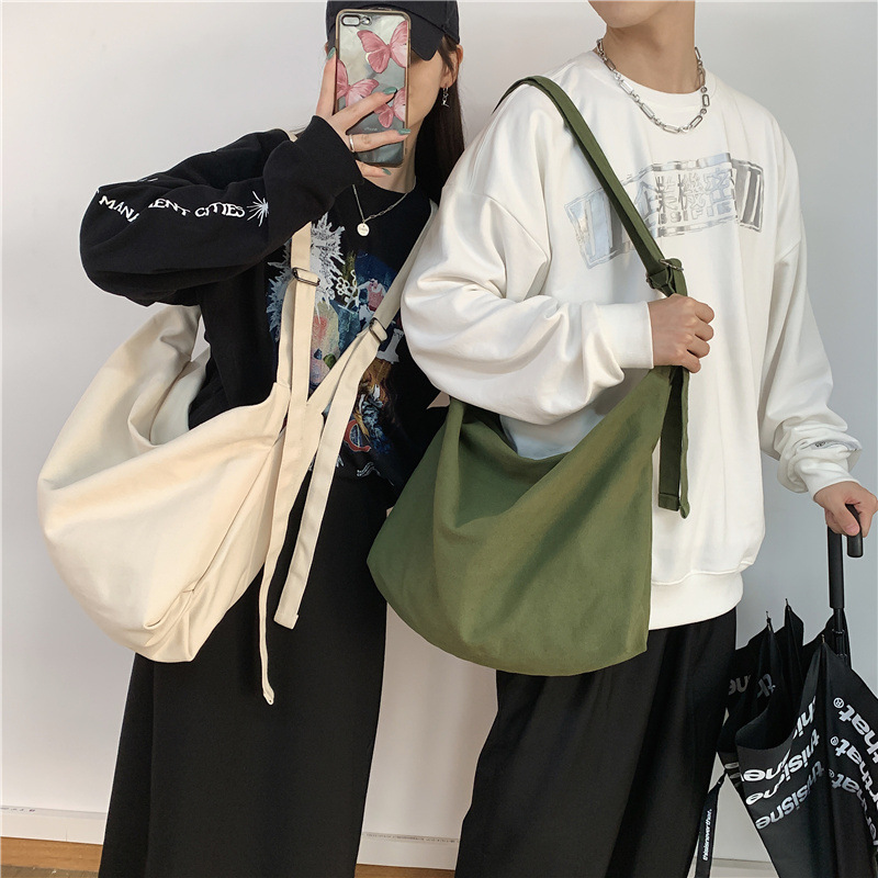 가방 여성의 새로운 도착 세탁 캔버스 크로스 백 한국 스타일 유행 대용량 어깨 가방 남성 일본식 솔리드 컬러 가방