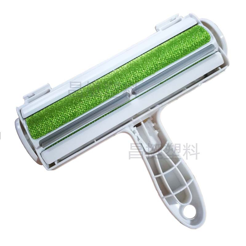 宠物刮毛器  绿 白图 昌挺