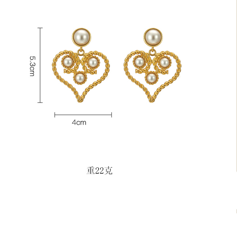 Baroque Retro Hollow Pearl Twist Heart Earrings Wholesale Nihaojewelry display picture 2