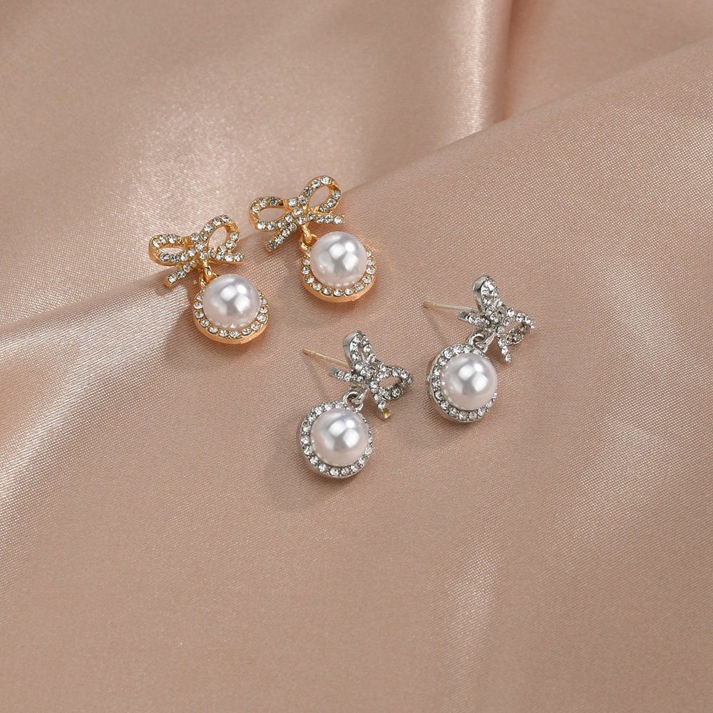 S925 silver needle Korea sweet and cute fairy fashion bow pearl alloy earrings wholesale