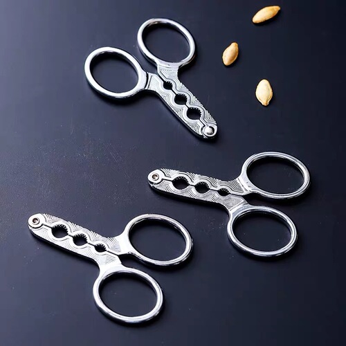 Factory direct sales zinc alloy melon seed clip to peel melon seeds and peelers to open melon seeds and pine nuts for lazy people to eat watermelon seeds and pine nuts.