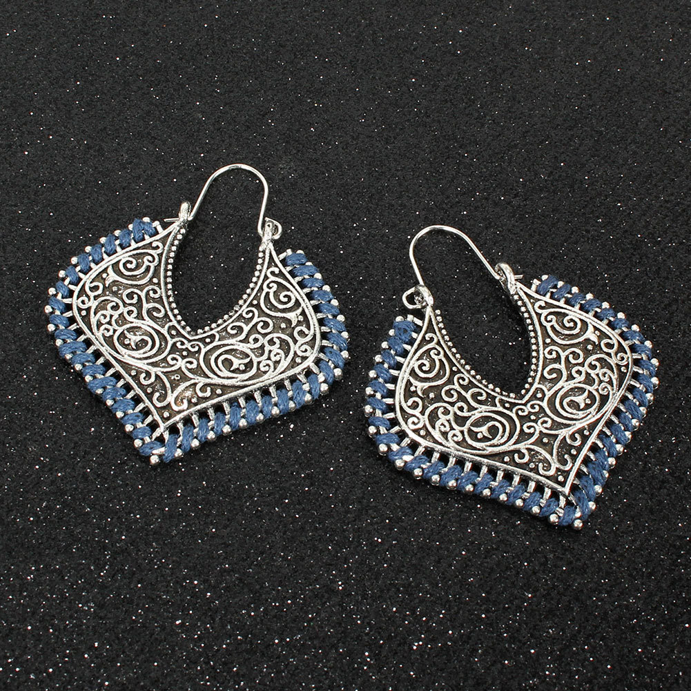 Exaggerated Hollow Carved Earrings Retro Simple Metal Braided Flower Earrings display picture 5