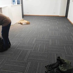 Elegant Vienna Paris office building company table tennis room PVC-backed square tiles fully laid minimalist carpet Instagram style