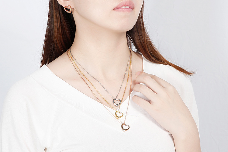 hollow heart-shaped three-layer necklace clavicle chain earrings set titanium steel set