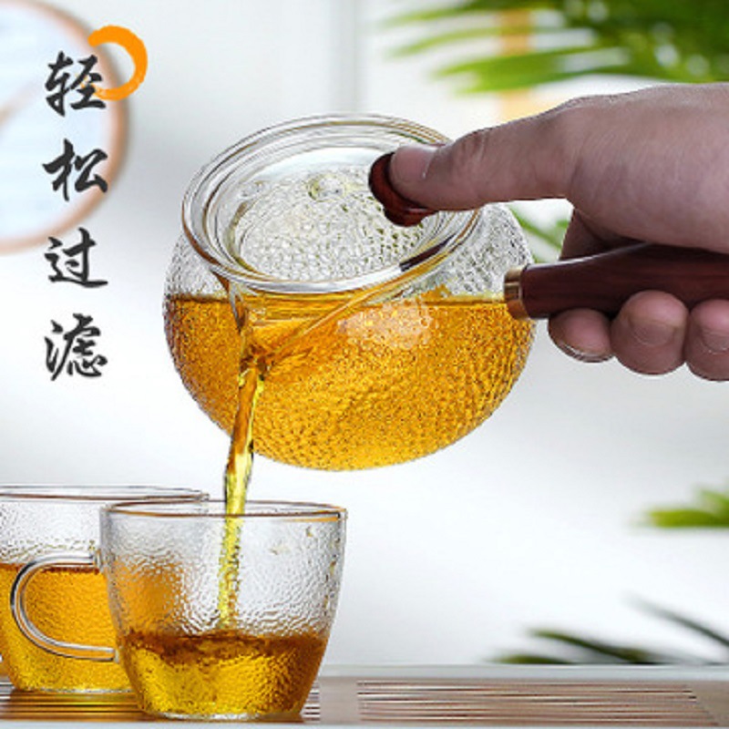 Fábrica al por mayor patrón de martillo mango lateral olla de vidrio resistente al calor tetera de La Flor eléctrica estufa de cerámica calefacción Kung Fu juego de té tetera