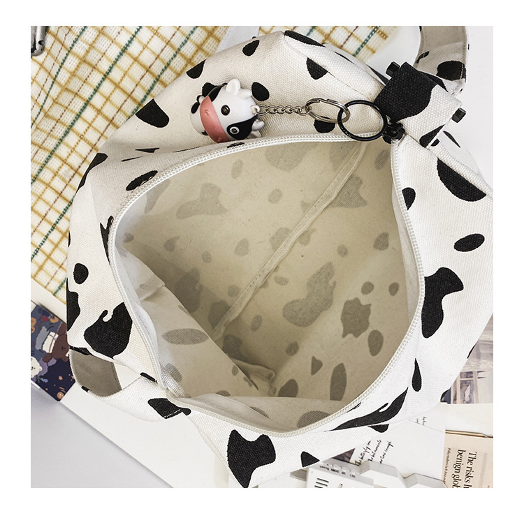 Korean New Simple Lazy Style Cute Cow Polka Dot Student Canvas Bag Class Bag Wild Messenger Bag Wholesale display picture 6