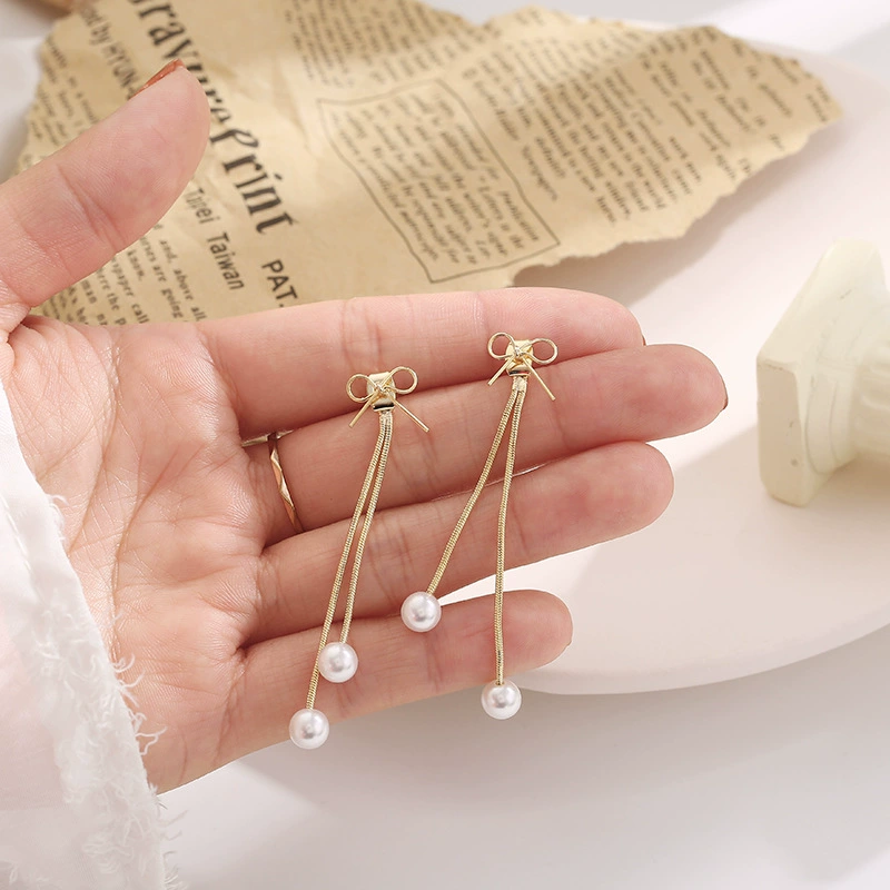 Universal earrings with bow from pearl, silver 925 sample