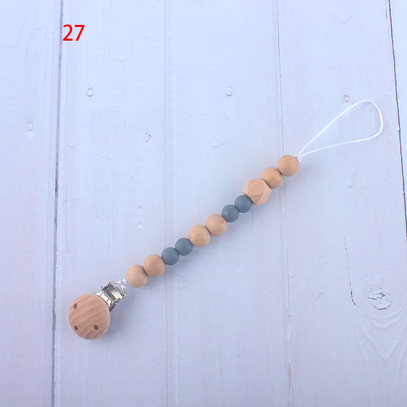 Nueva fábrica directa bebé Beech juguete mordedor bebé chupete de silicona pezón anti-gota cadena materna y infantil suministros