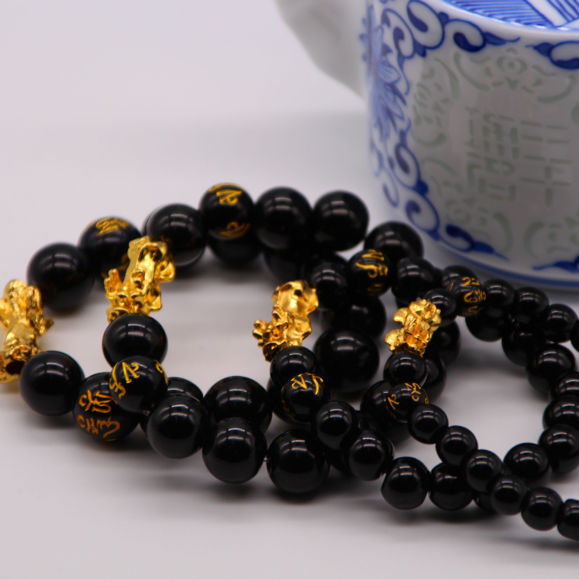 越南沙金貔貅手串六字真言金珠仿黑曜石貔貅手串男女款地摊直播