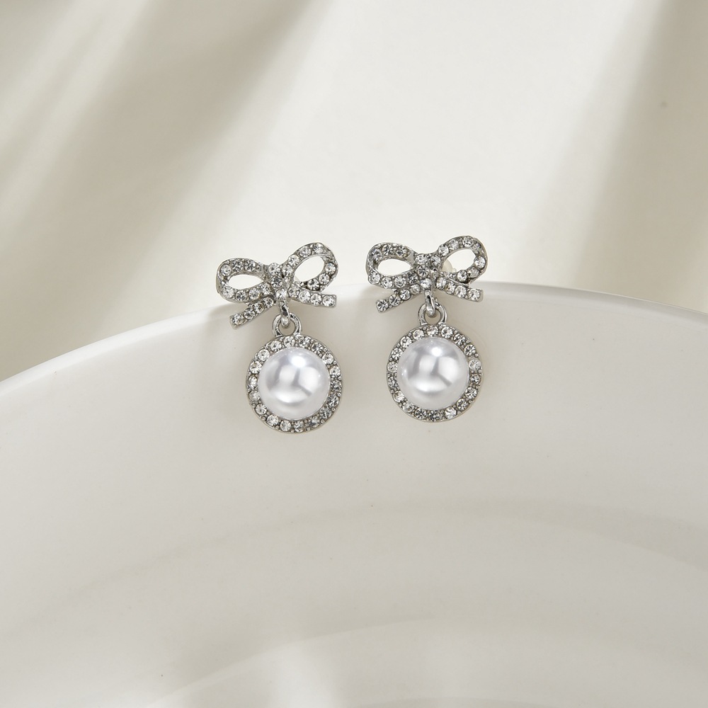 S925 Silbernadel Korea Süße Und Süße Fairy Fashion Bogen Perle Legierung Ohrringe Großhandel display picture 4