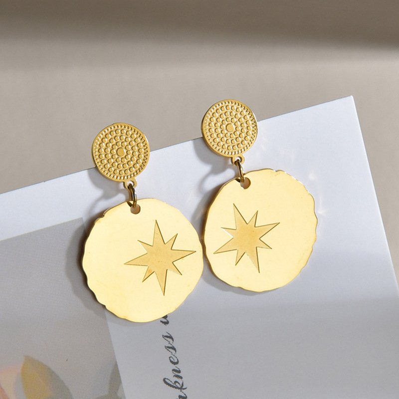 Aretes Redondos Con Estrella De Ocho Puntas display picture 5