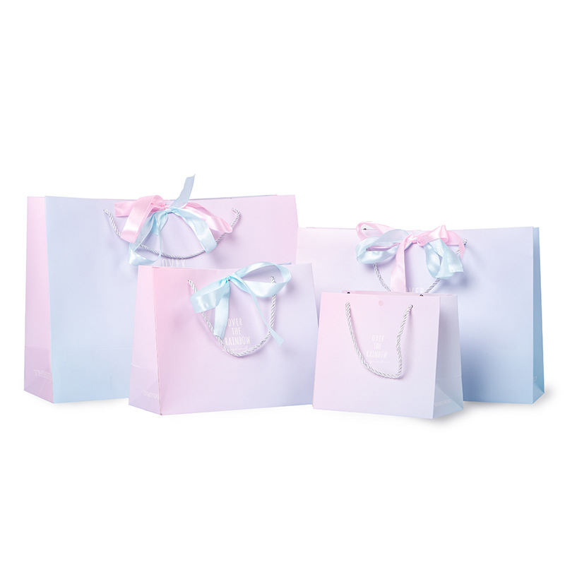 Nueva bolsa de regalo ins estilo bolsa de embalaje bolsa de regalo degradado tienda de ropa bolso de papel bolsa portátil de regalo