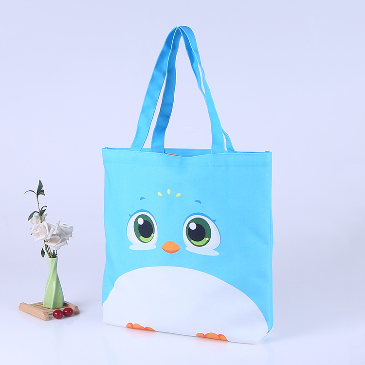 个性创意按扣袋制定 卡通学生帆布袋供应 可爱企鹅棉布袋印刷logo
