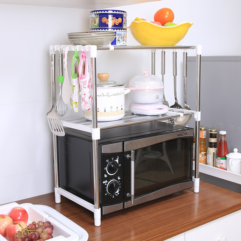 Estante de cocina personalizado Estante de almacenamiento de horno de microondas telescópico de acero inoxidable Estante de horno creativo de piso Gabinete