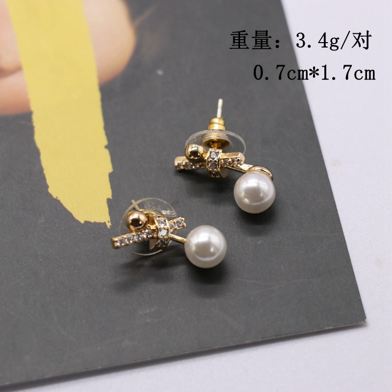 Knotted Bowknot Asymmetrical Stud Earrings display picture 1