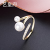 Golden fashionable brand quality ring from pearl, silver 925 sample, diamond encrusted, on index finger