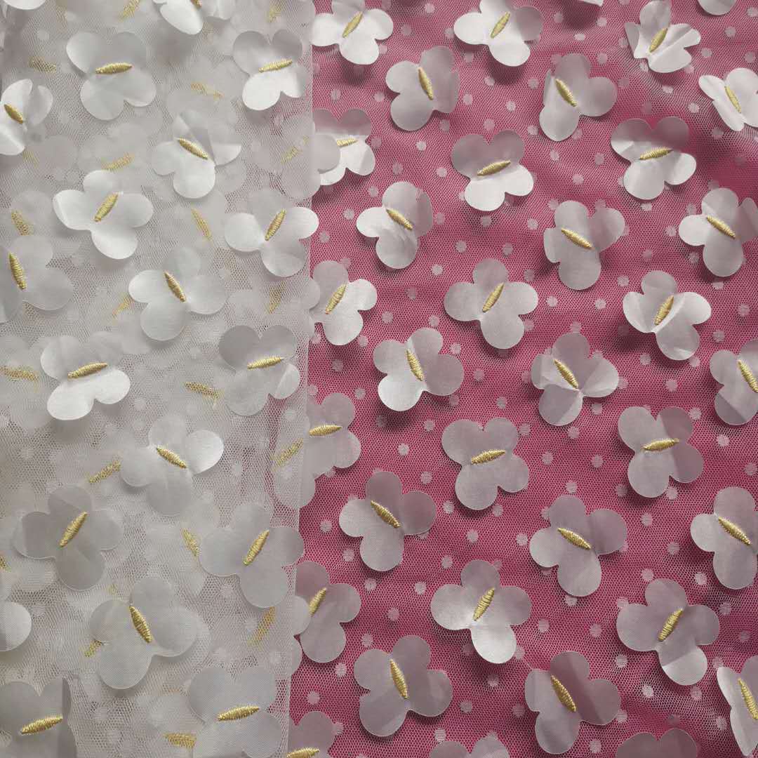 新款无弹涤大圆点提花网布底布雪纺蝴蝶激光刺绣 童装等面料 现货