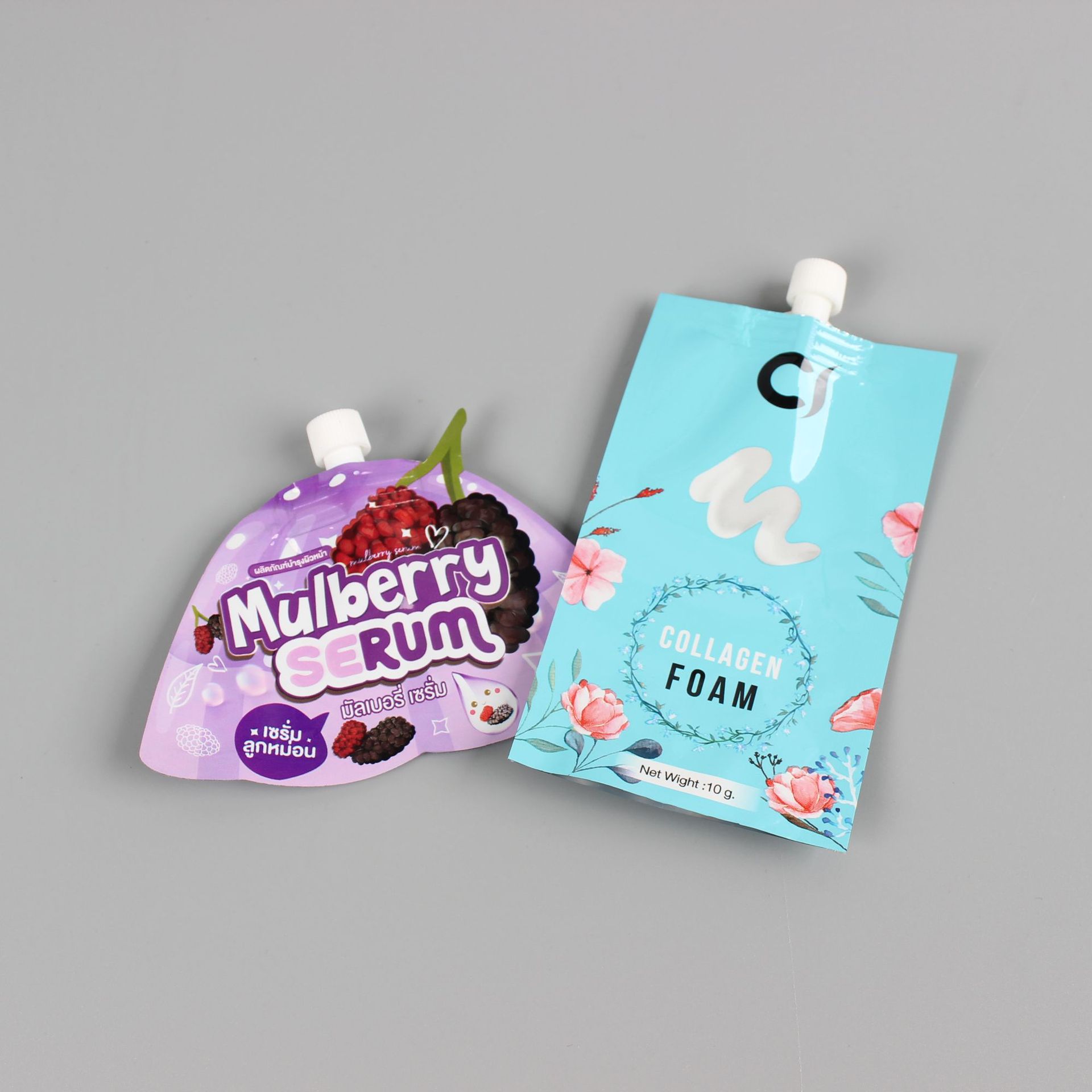 厂家批发25ML玫瑰精华液面膜液小袋装40ML沐浴露洗发水吸嘴包装袋