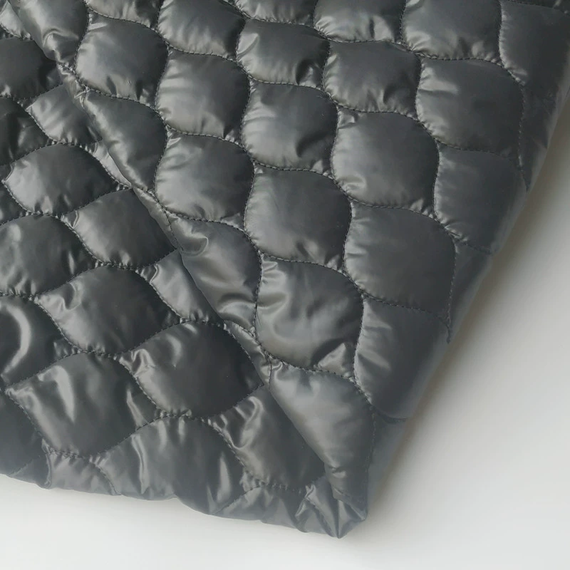 Polyester taffeta embroidered fabric 50D high-density film calendered quilted 140g spray-coated cotton composite quilted warm down