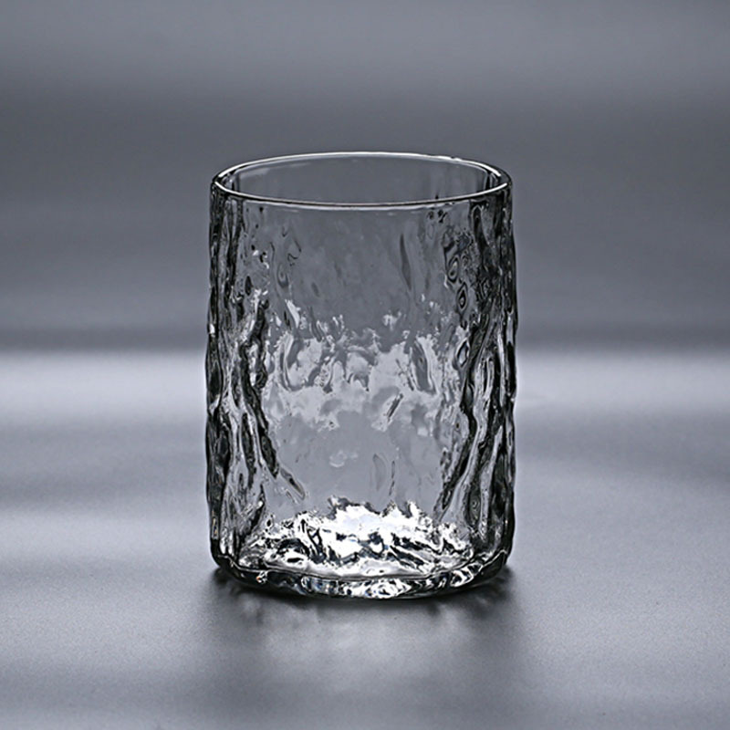 Fábrica al por mayor patrón de martillo japonés vidrio borosilicato material de vidrio resistente al calor Taza de una sola capa patrón de árbol de la casa taza de té