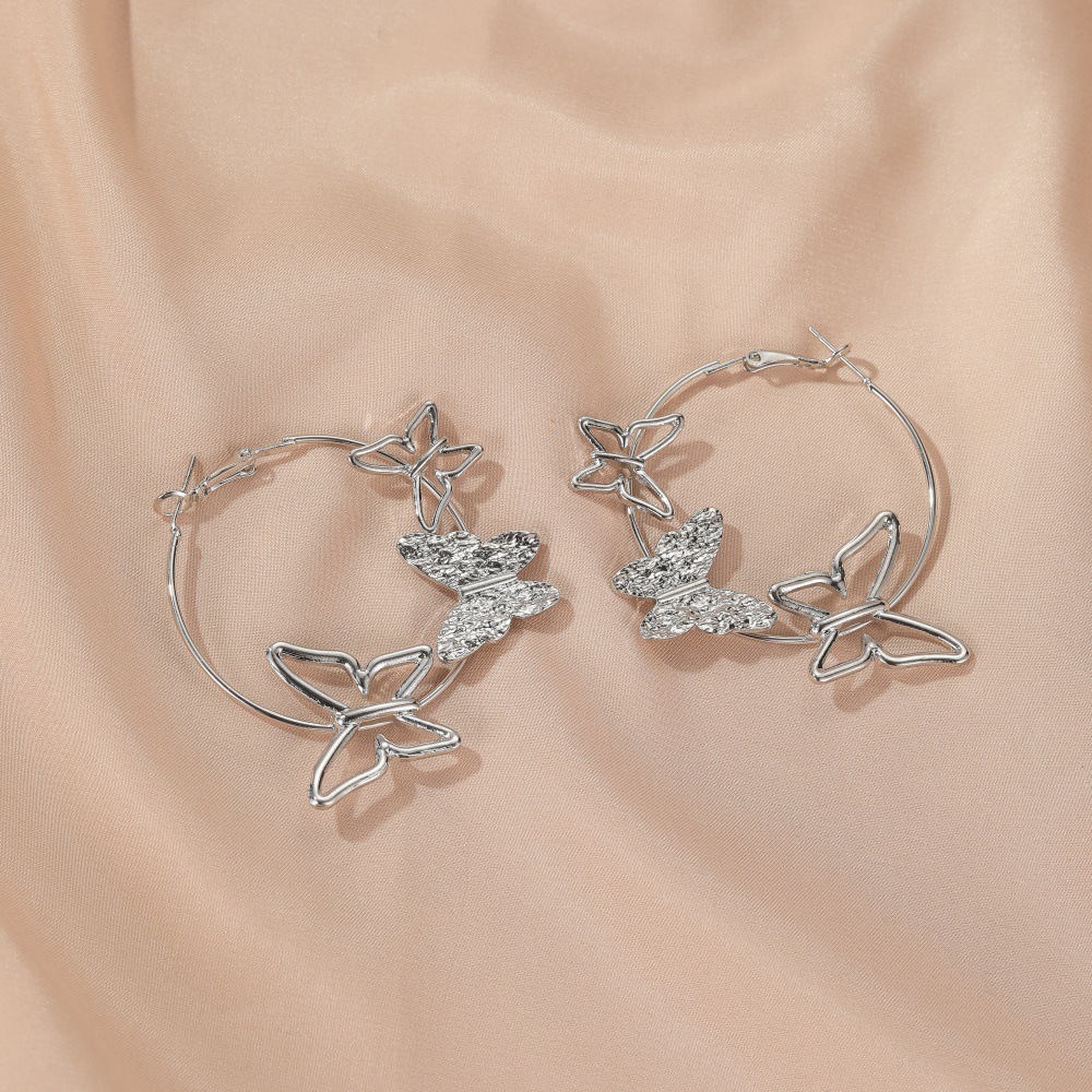 New  Exaggerated Simple  Personality Hollow Three Butterfly Earrings Wholesale display picture 7