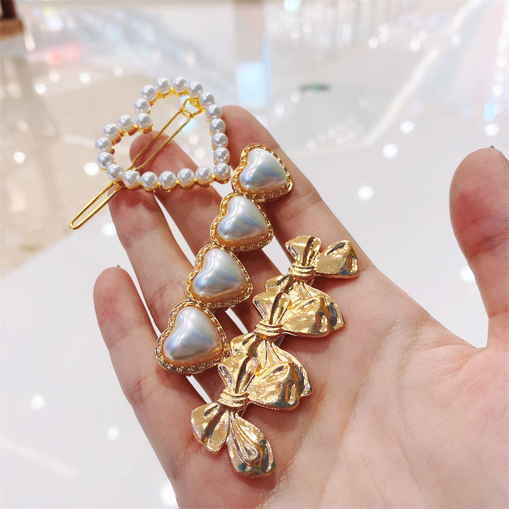 Korean Style Bow Metal Pearl Heart-shape Alloy Hairpin display picture 2