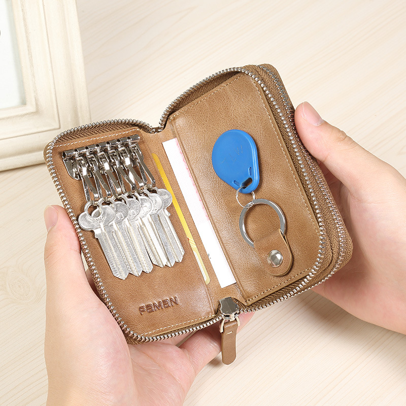 創意的な自動車のキーは男性の本革のファスナーの男性の鍵を包んで牛皮の多機能の腰を掛けて鍵をかけます。