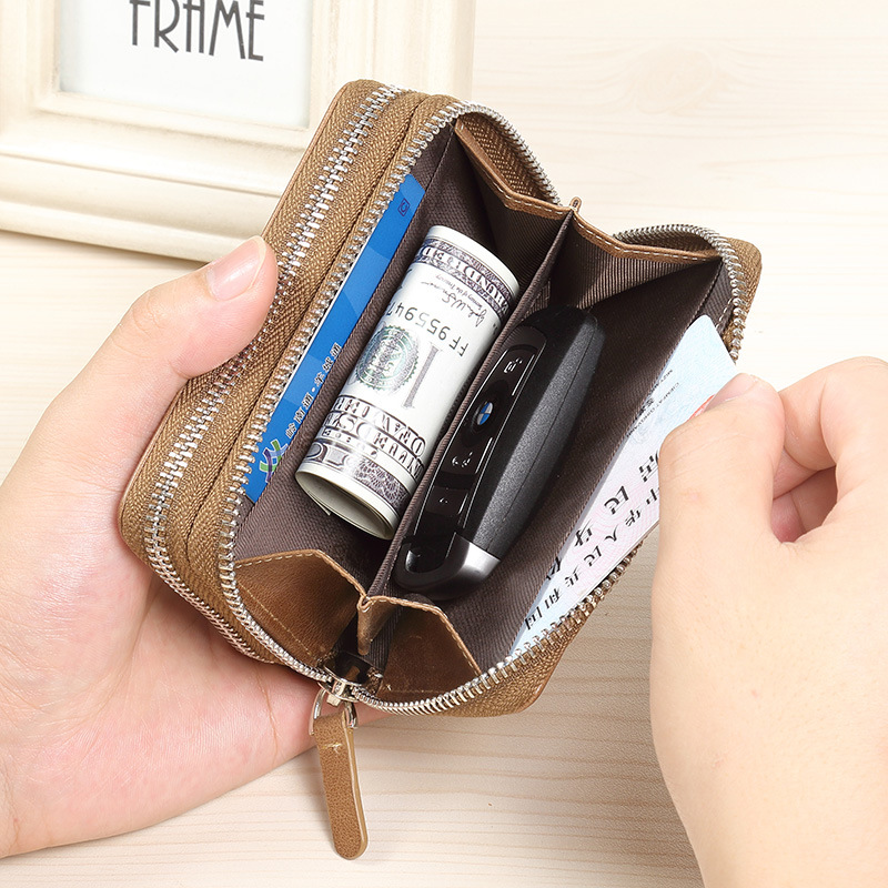 創意的な自動車のキーは男性の本革のファスナーの男性の鍵を包んで牛皮の多機能の腰を掛けて鍵をかけます。