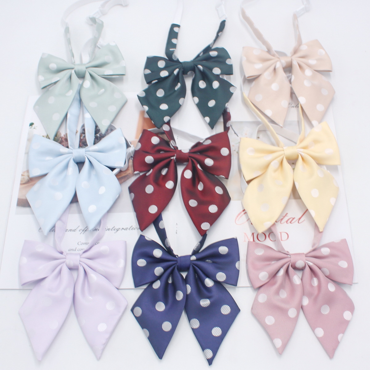 Fabricante en stock niñas punta pluma raíz pajarita estilo coreano casual color sólido arco gran lunares JK uniforme collar flor