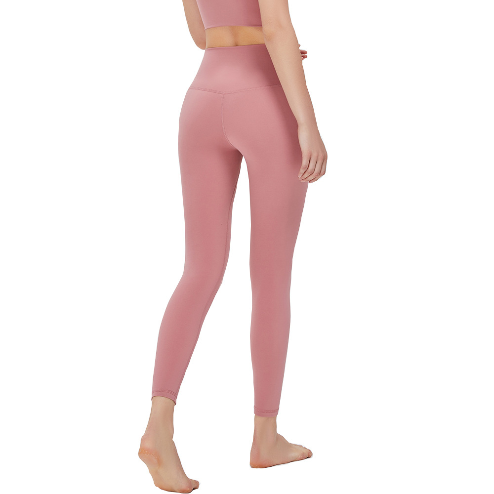 Nuevos pantalones de yoga de cintura alta desnuda europea y americana de las mujeres corriendo Pantalones deportivos sin vergüenza línea apretado cadera levantamiento fitness Pantalones