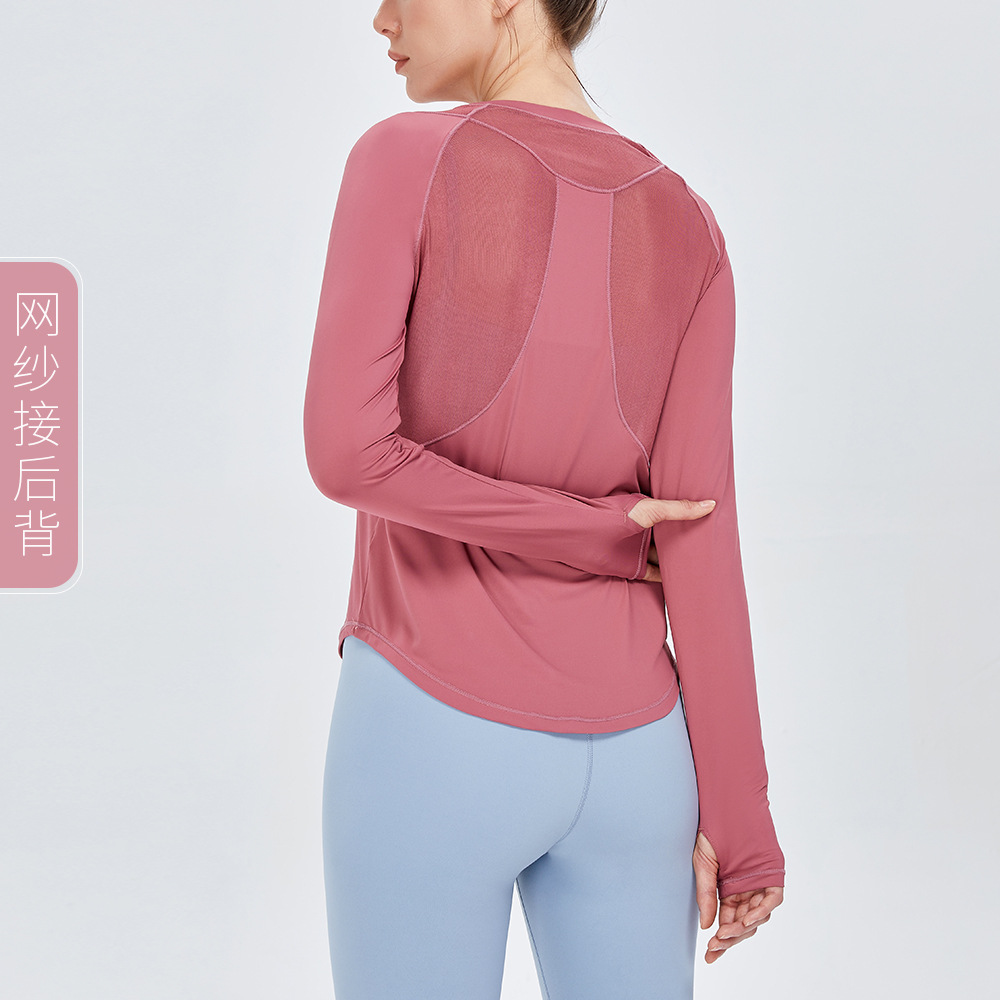 Otoño e invierno nuevo yoga europeo y americano camiseta deportiva de manga larga costura de malla de mujer versátil transpirable running fitness top