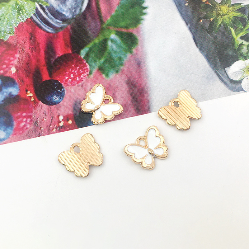 1 DIY accesorios de joyería hechos a mano goteando pequeña mariposa colgante collar pendientes pulsera colgante paquete de material