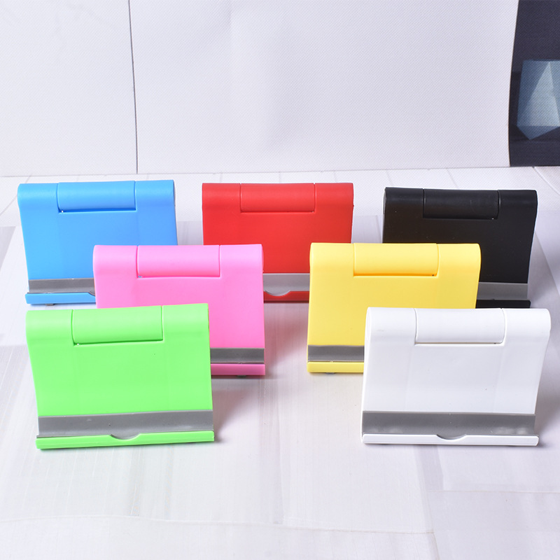 Soporte de teléfono móvil de plástico en stock tableta de teléfono móvil soporte plegable universal soporte de teléfono móvil de escritorio de publicidad impreso LOGO