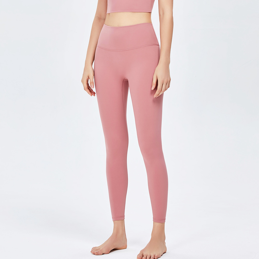 Nuevos pantalones de yoga de cintura alta desnuda europea y americana de las mujeres corriendo Pantalones deportivos sin vergüenza línea apretado cadera levantamiento fitness Pantalones