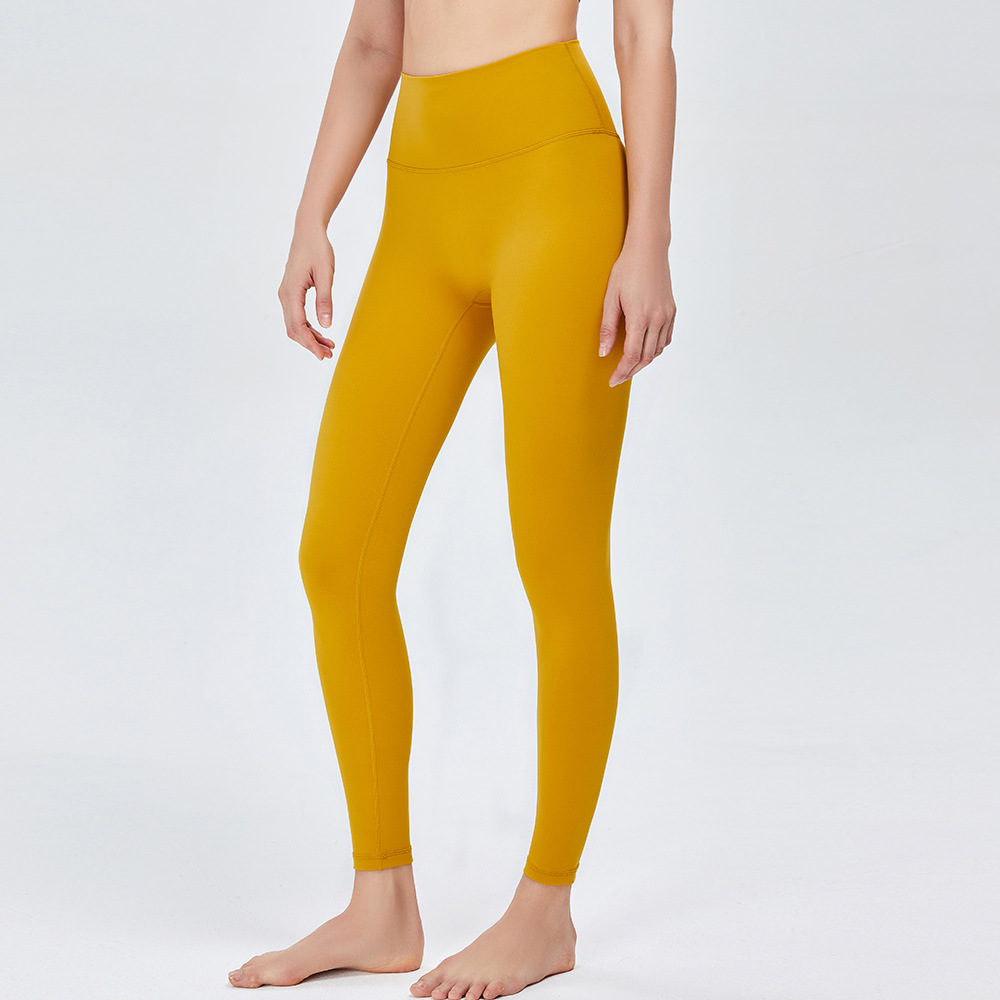 Nuevos pantalones de yoga de cintura alta desnuda europea y americana de las mujeres corriendo Pantalones deportivos sin vergüenza línea apretado cadera levantamiento fitness Pantalones