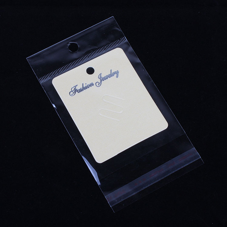 厂家直销包装饰品透明opp袋子 7*12.7cm 内空7*7cm通用带挂带胶