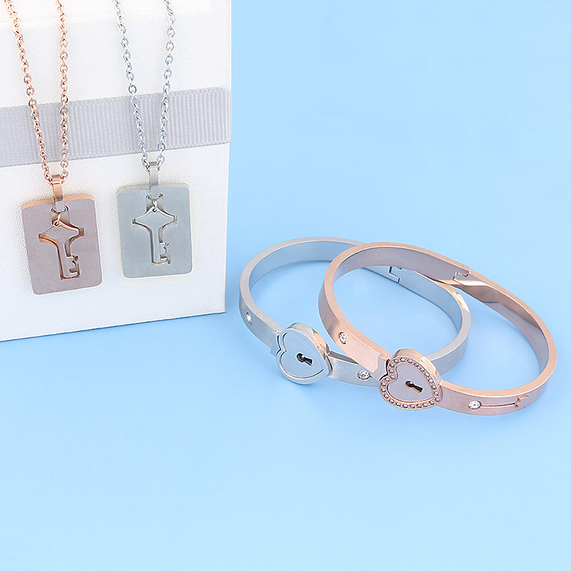 Regalo del Día de San Valentín pareja de acero de titanio amor bloqueo Shake cerradura concéntrica pulsera keyset Collar para hombres y mujeres enclavamiento