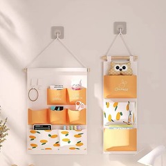 Manufacturer fabric storage bag hanging bag wall hanging storage wall hanging dormitory artifact bedroom bag mobile phone wholesale