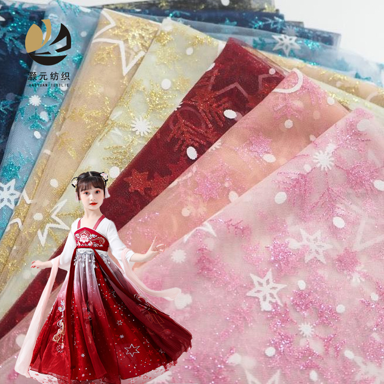 Fabricantes promocionales de bajo precio doble impresión de copo de nieve oro hilo de malla de nieve estrella vestido vestido vestido vestido tela de falda