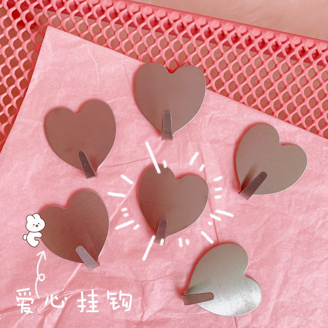 Estilo coreano Nuevo Hogar simple creativo pegajoso gancho amor corazón plata Acero inoxidable gancho de la habitación sin fisuras gancho decorativo