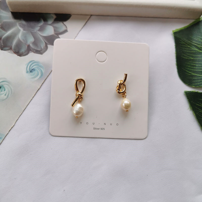 Asymmetrical organic design fashionable earrings from pearl