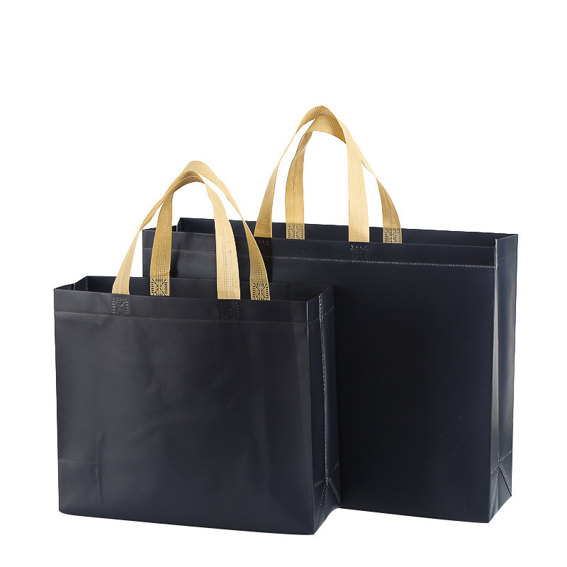 En stock película publicitaria bolso no tejido impermeable protección del medio ambiente ropa zapatos bolso de compras en blanco logotipo impreso