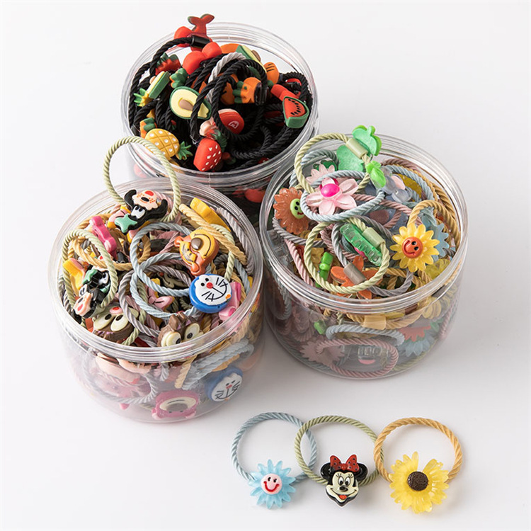 Nuevo estilo coreano bebé cuerda de pelo lazo de pelo banda de goma cuerda de pelo de dibujos animados caja de plástico enlatados niños de dibujos animados banda de pelo al por mayor
