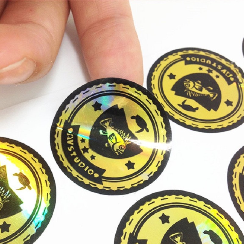 镭射烫金色贴纸标签定制logo帽子印刷防水封口贴广告纸不干胶订做